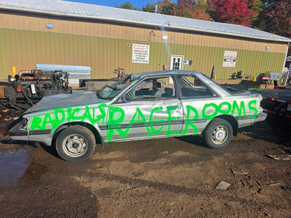 Car painted with the Radicals Rage Rooms logo ready to smash